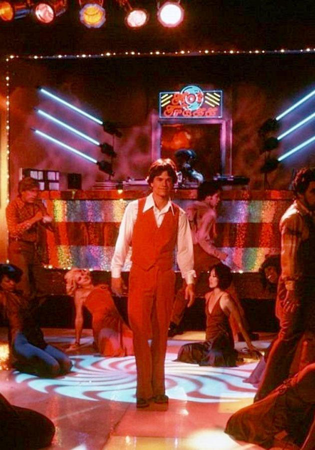 Dirk Diggler (Mark Wahlberg) shakes his groove thang in Boogie Nights.