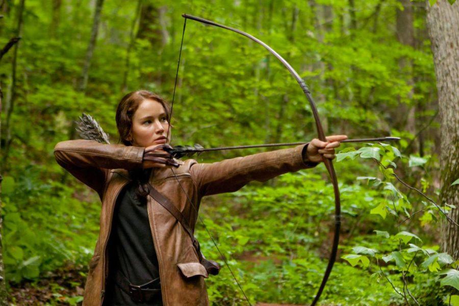 Jennifer Lawrence as Katniss Everdeen goes in for the kill in The Hunger Games.