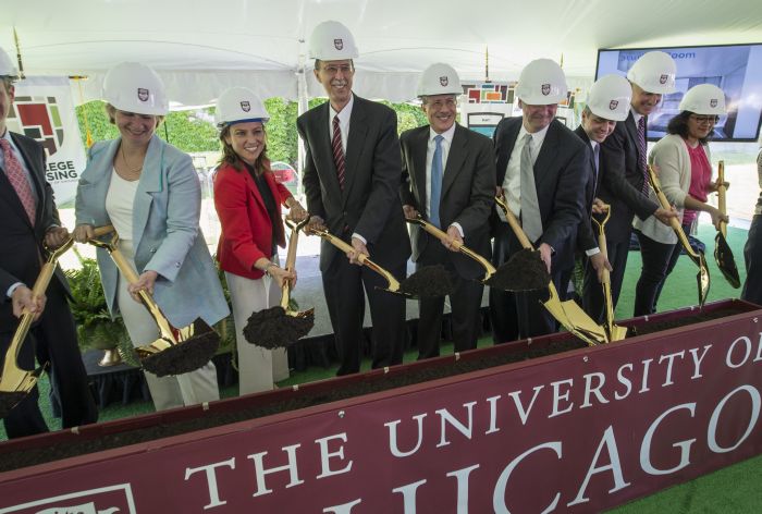 Officials including Associate Vice President and Chief of Staff in the Office of the President Katie Callow-Wright, Dean of the College John W. Boyer, and Chairman of the Board of Trustees Andrew Alper, break ground on the Campus North residence hall and dining commons. .