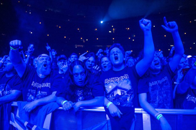 Iron Maiden fans rock out to the legendary metal band at the United Center. 