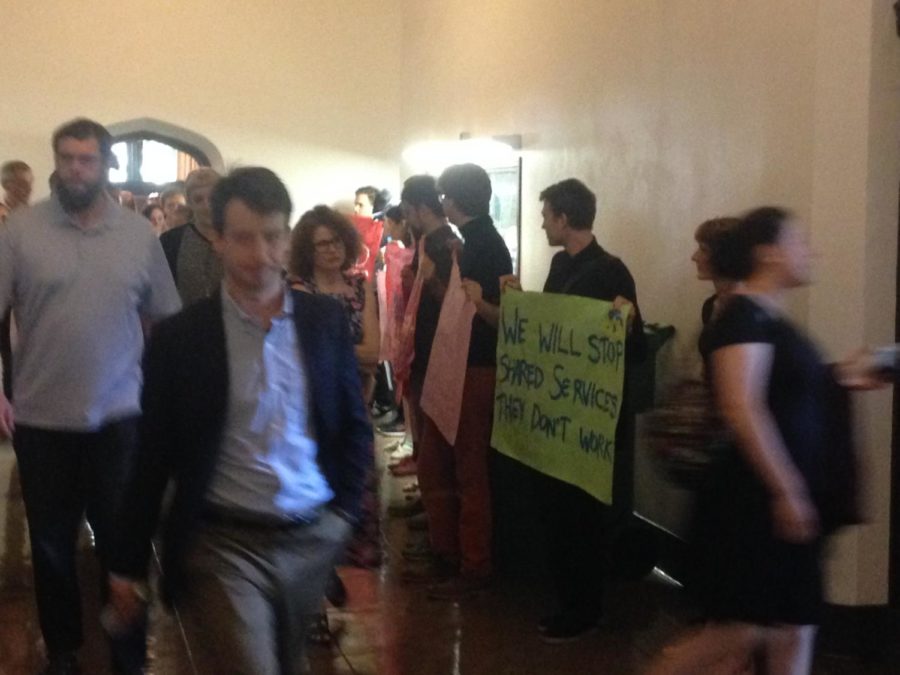 Activists associated with  the IIRON Student Network  and GSU protested the budget cuts outside a May 31 staff meeting. 
