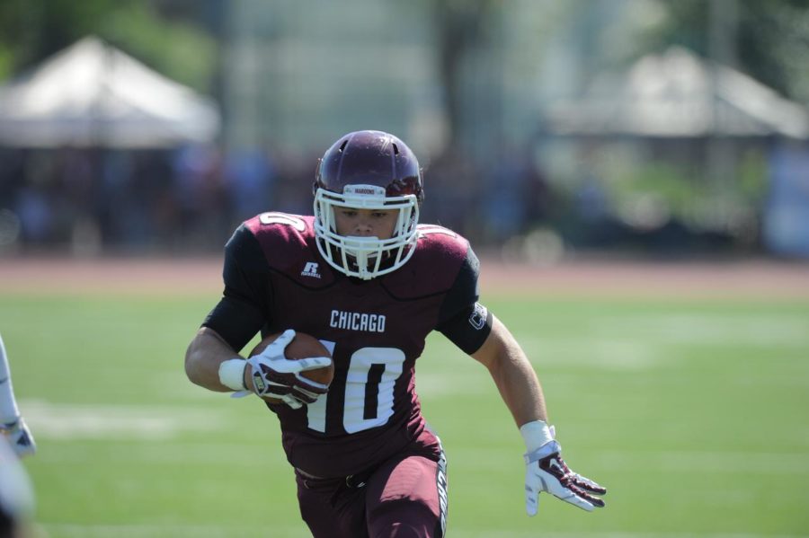 Third-year running back Chandler Carroll carries the ball for the Maroons.