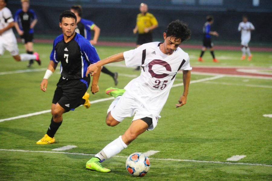 Second-year Juan Barrero attempts to kick the ball up the field.
