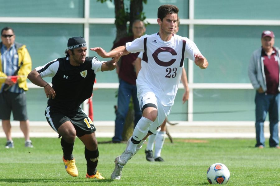 Third-year Andre Abedian runs past chasing defender and moves the ball up the field.