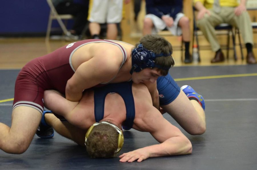 Third-year Nicholas DiNapoli pins down his opponent effortlessly.