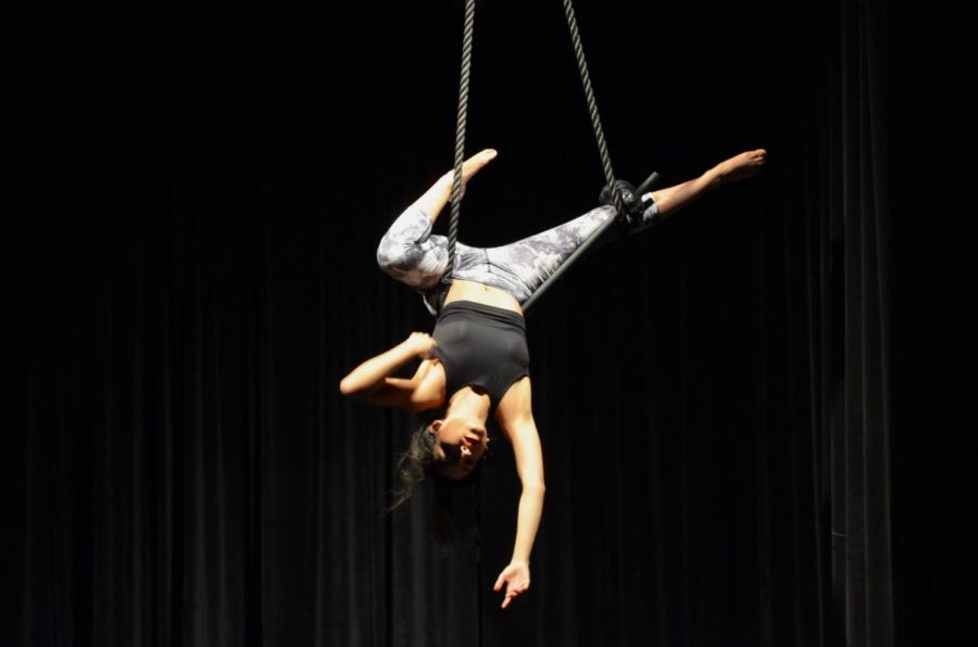 Third-year+Hannia+Frias+performs+a+trapeze+act.