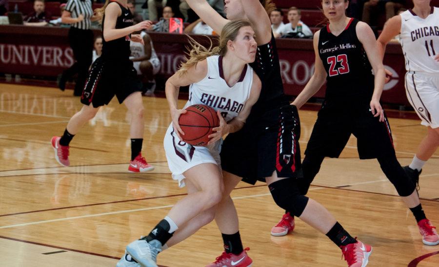 Fourth-year Britta Nordstrom charges towards the basket amidst defenders.