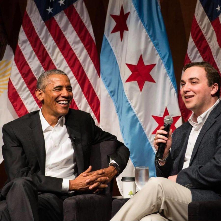 Former President Barack Obama speaks with third-year Max Freedman in an appearance at the Logan Center.