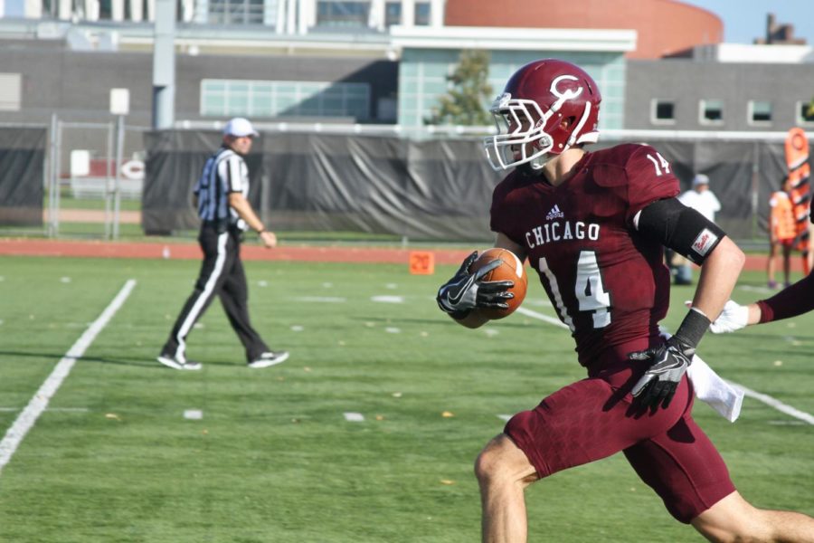 Fourth-year cornerback Andrew Beytagh recovers the ball for the Maroon defense.