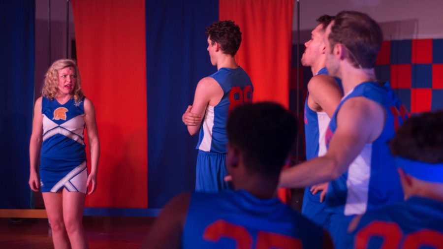 Lysistrata Jones (Mary-Margaret Roberts) addresses a group of basketball players.