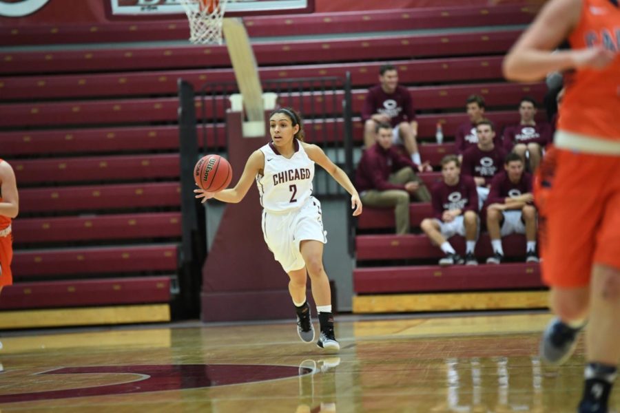 Second-year Mia Farrell brings the ball up the court.