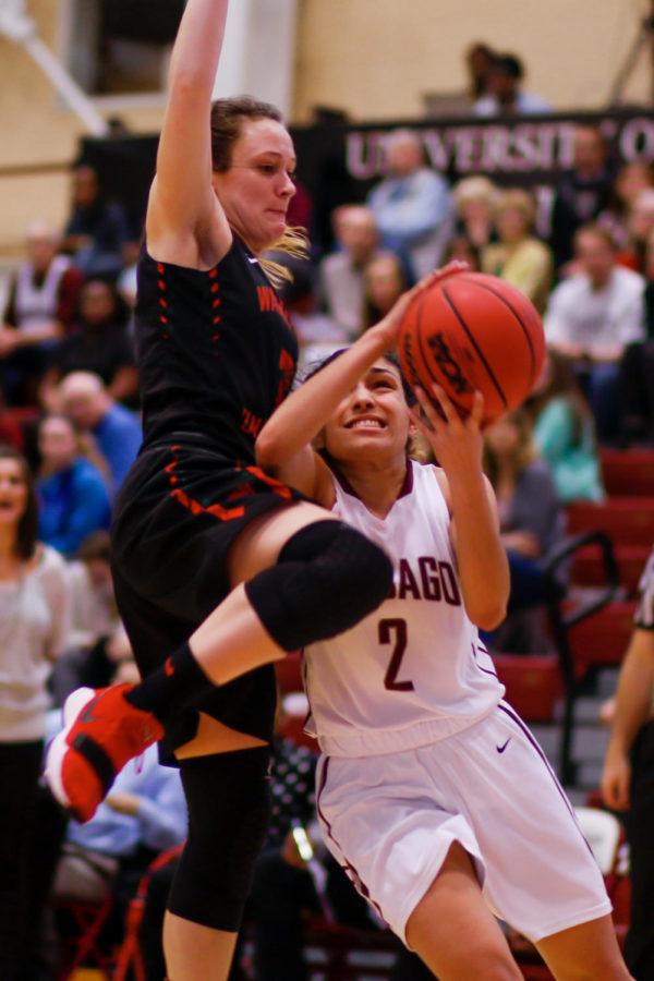 Second-year Mia Farrell gets physical as she goes up for a lay-up against Wash U.