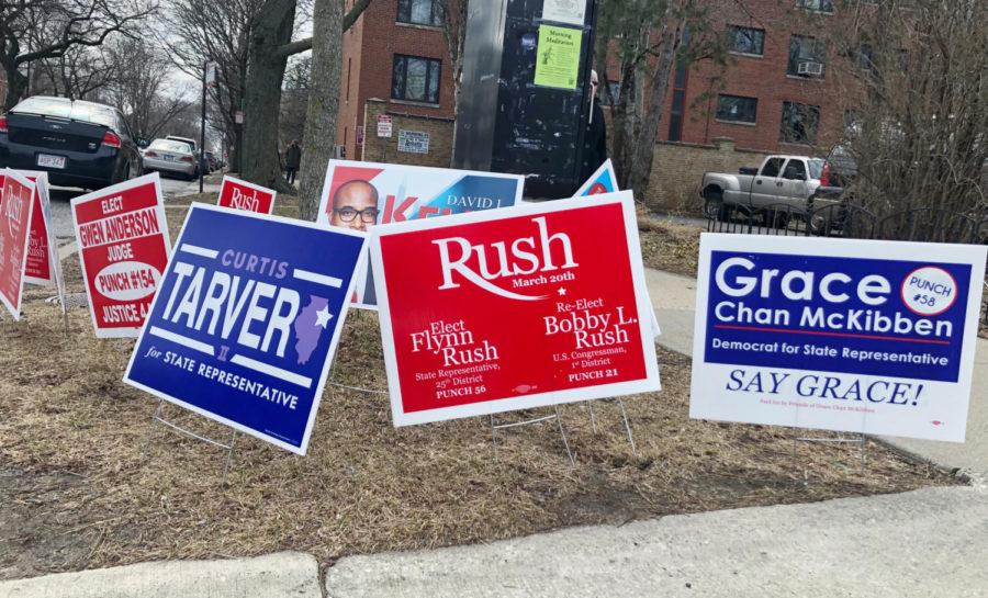 Signs+for+three+of+the+leading+candidates+for+25th+district+state+representative+on+a+corner+in+Hyde+Park.