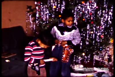 The Christmas season at the home of Dr. George Reed, a physicist at Argonne National Laboratories whose family lived on Calumet Avenue in Woodlawn. This still comes from a film shot in the 1950s.