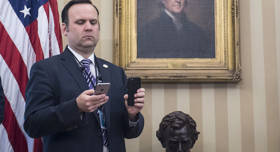 Dan Scavino, White House Director of Social Media and a co-defendant in Knight Institute v. Trump, films the President during a signing ceremony in the Oval Office.
