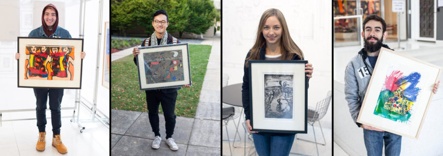 Students with artwork from the Art to Live With collection.