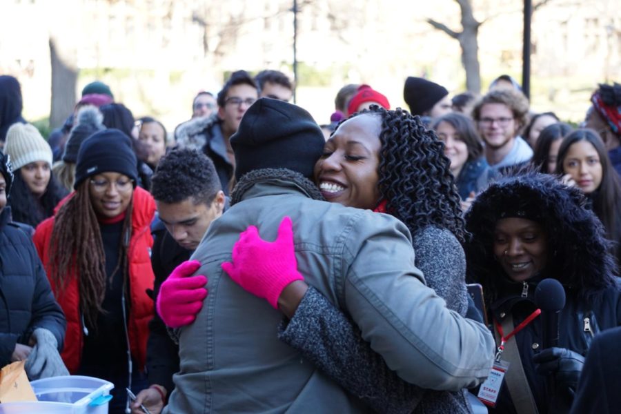 Enyia hugs an organizer on her campaign during the rally.