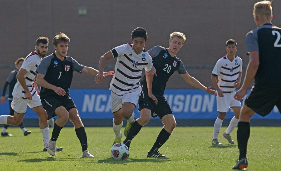 Fourth-year Matthew Koh battles a Calvin Knight player for possession.