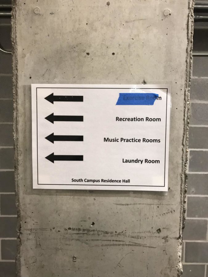 In South Campus Residence Hall, tape mysteriously covers the sign pointing to the Exercise Room.