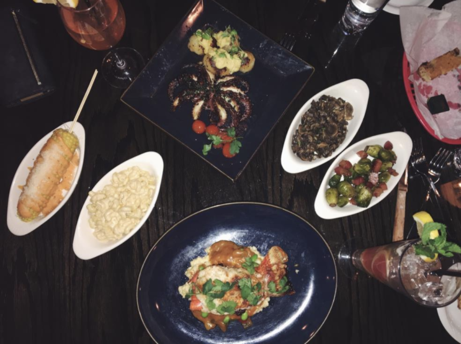 Clockwise from top: Grilled Spanish Pulpo, Sauteed Mushrooms, Brussel Sprouts, Maine Lobster, Truffle Mac and Cheese, Elote.