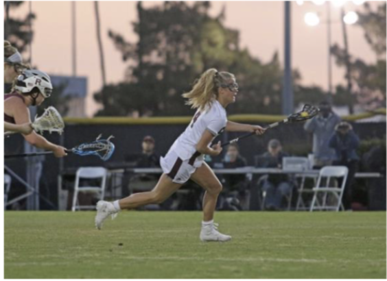 First-year midfielder Karina Schulze runs past the competition. 

Courtesy of UChicago Athletics.