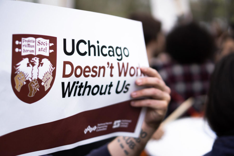 University of Chicago Labor Council members held signs reading: UChicago Doesnt Work Without Us.