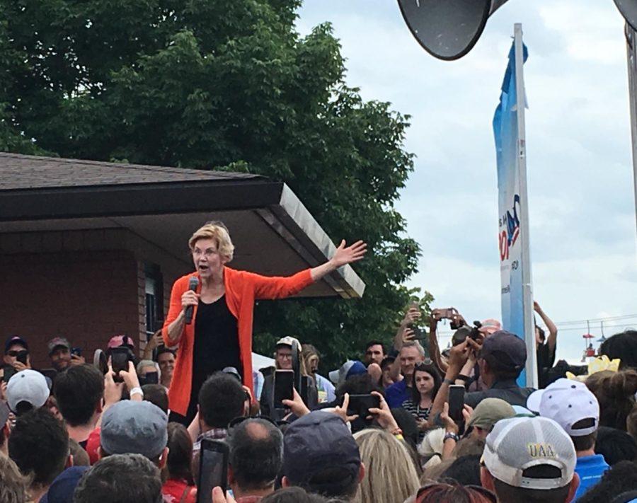 Elizabeth Warren addresses a crowd at the Iowa State Fair as she makes her pitch for the caucuses.