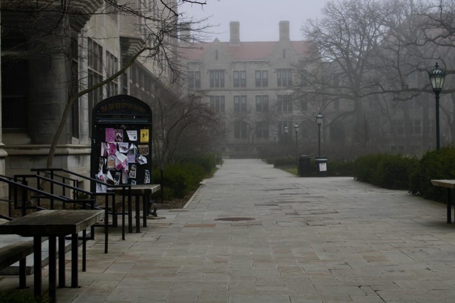 A+misty+day+on+a+seemingly+empty+main+quad%2C+during+UChicagos+spring+break+in+2020%2C+after+many+students+had+departed+from+campus.