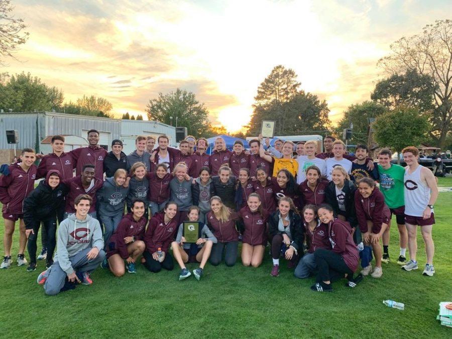 The cross country poses for a photo after a meet in autumn of 2019.