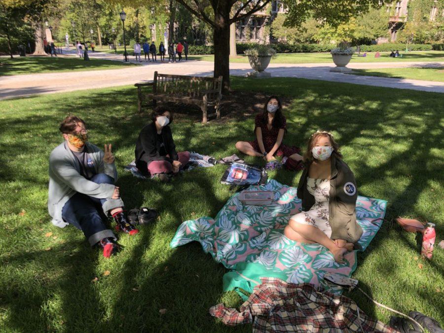 Pictured (Left to Right): Players Tristan Bachmann, Arielle Roane, Melia Allan, and Liz Chen have a socially-distanced picnic.