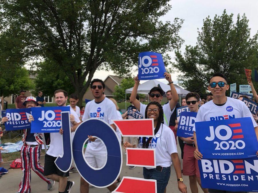Third-year Cassandra Crevecoeur, standing behind the E in Joe, marches with the Biden campaign.