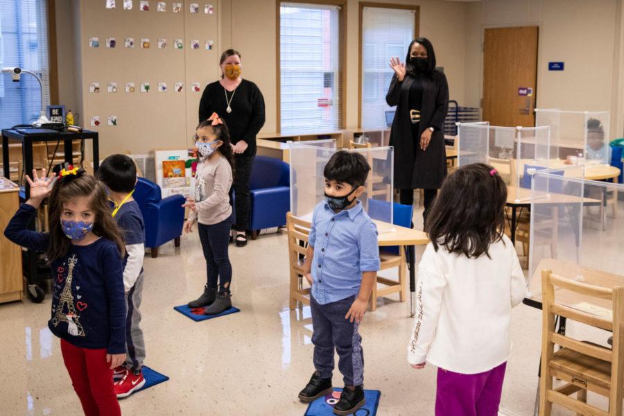 Chicago Public Schools CEO Janice Jackson waves to students in a preschool classroom at Dawes Elementary School on Jan. 11, 2021.