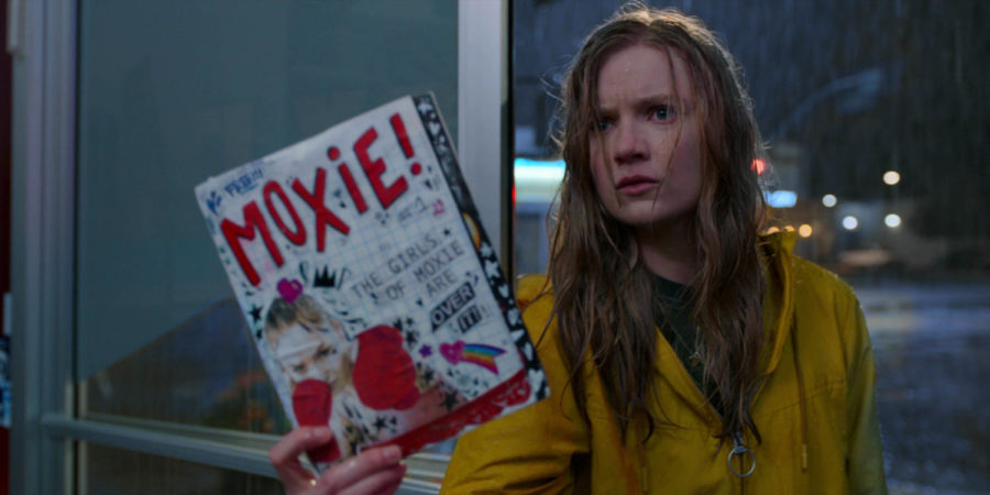 Vivian (Hadley Robinson), the heroine of Moxie, holds up the titular magazine defiantly. Because she is defiant. And defies the patriarchy.
