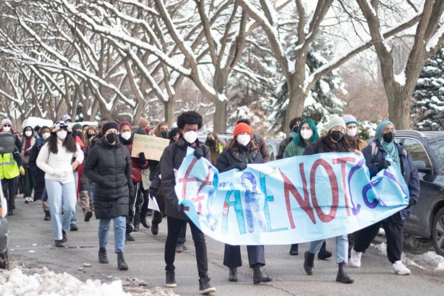 Protesters march down East 59th Street on Friday, February 4, as part of a rally organized by #CareNotCops.