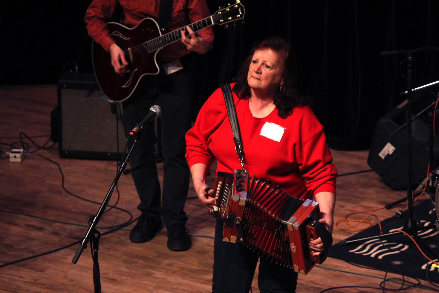 Sheryl Cormier and her Cajun band, including her husband on washboard and her grandson on drums, play on the Mandel Hall stage Friday night.