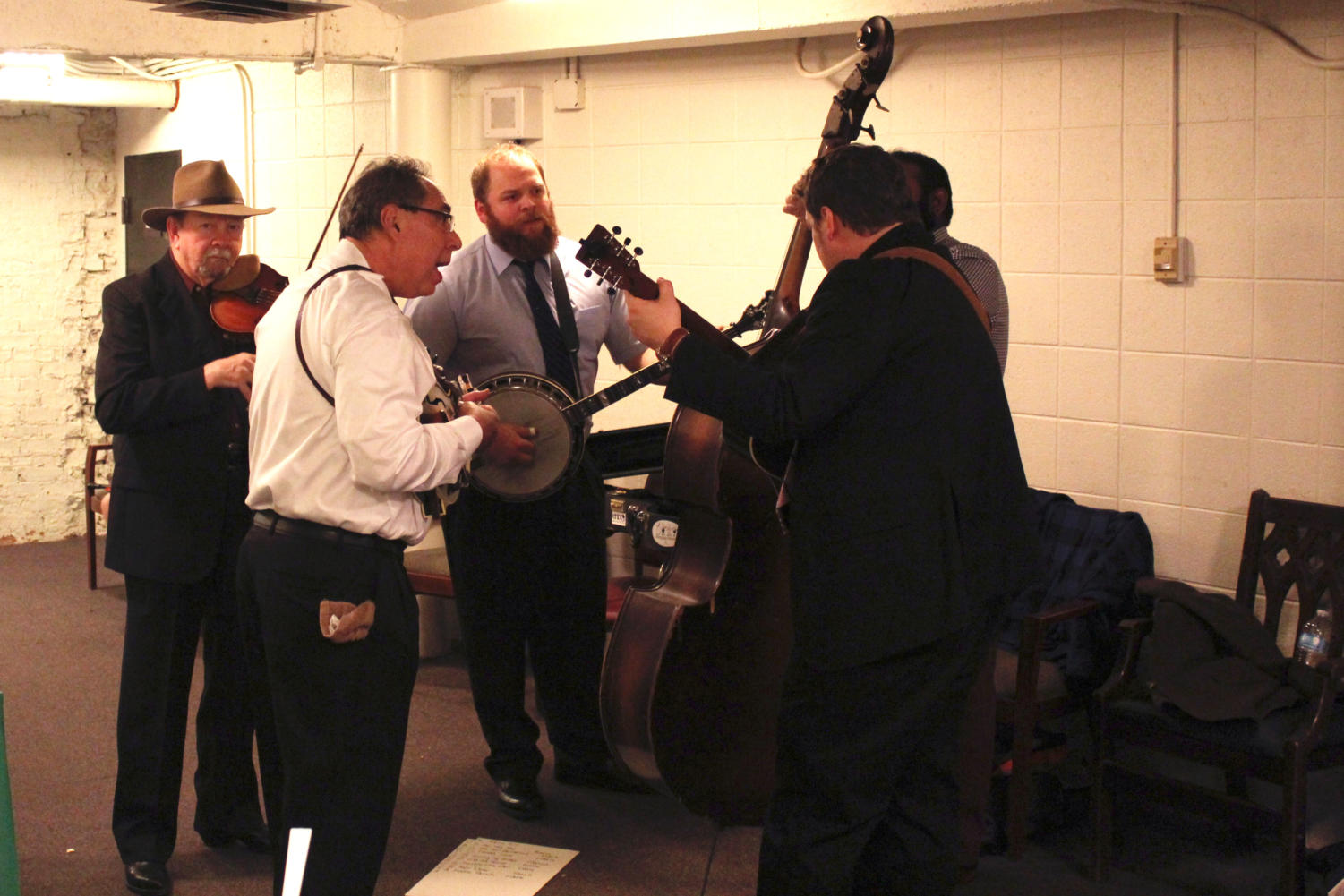 Bobby Hicks and his band practice their bluegrass set in the Mandel Hall Green Room.