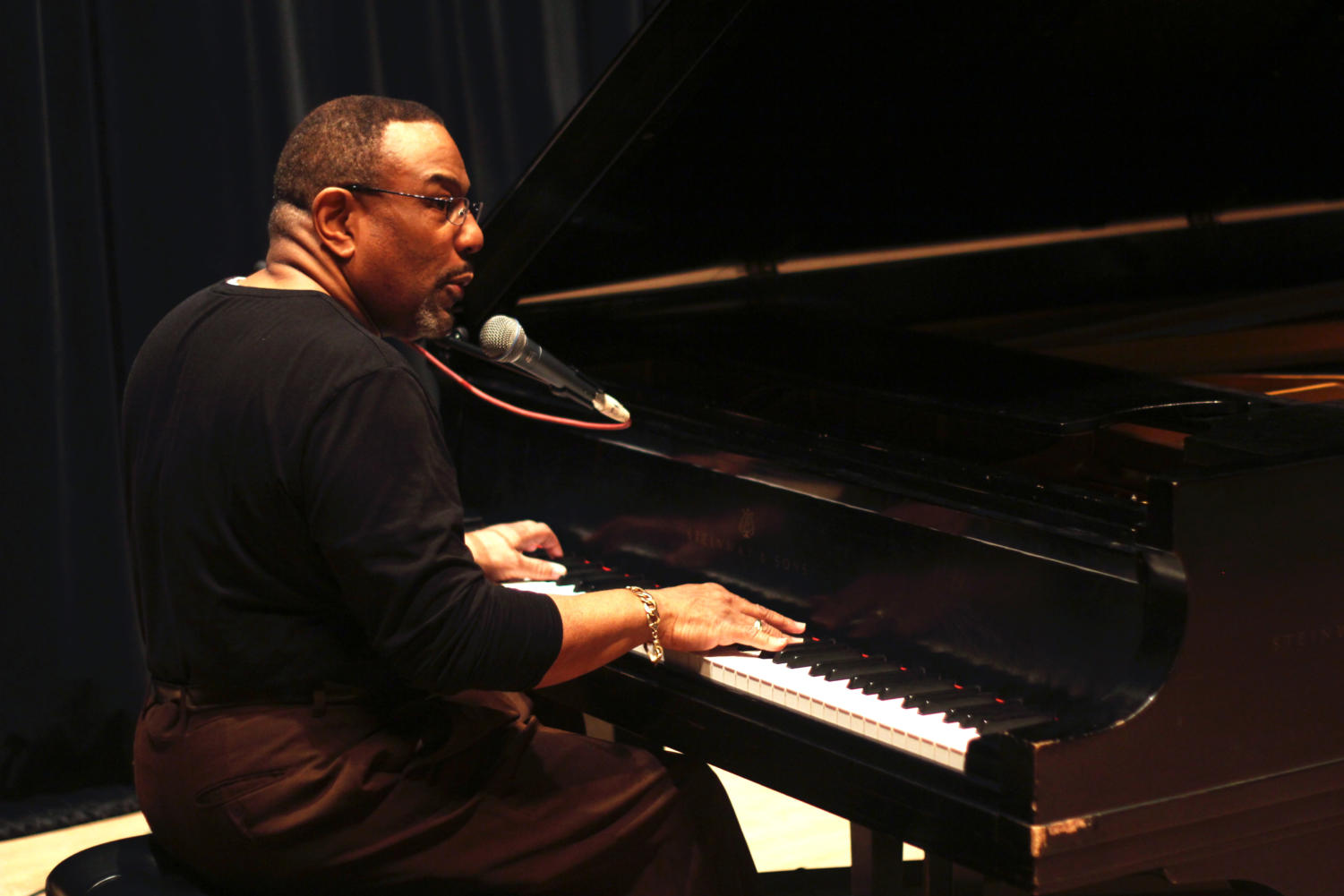 Chicago gospel singer Calvin Bridges practices piano and singing at his sound check before the Sunday night show.