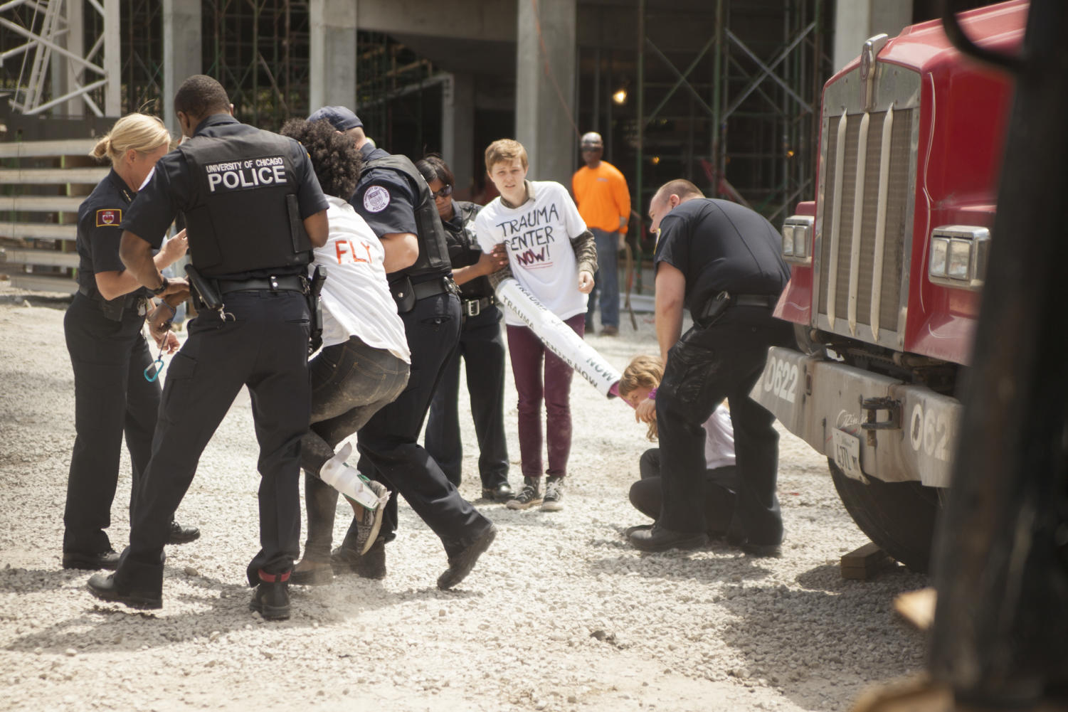 Forty minutes after entering the construction site, University police removed FLY member Tori Crider (left) and second-years Kayli Horne (center) and Helena Bassett from the premise.