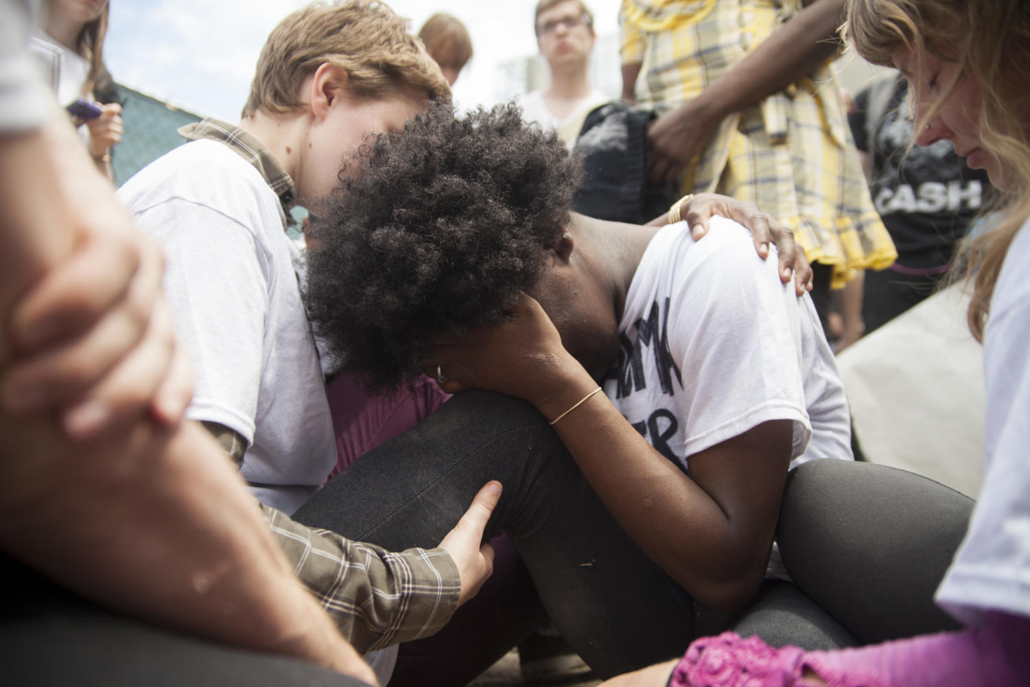 Second-year Kayli Horne (left) comforts FLY member Tori Crider after the day's protest came to an end.