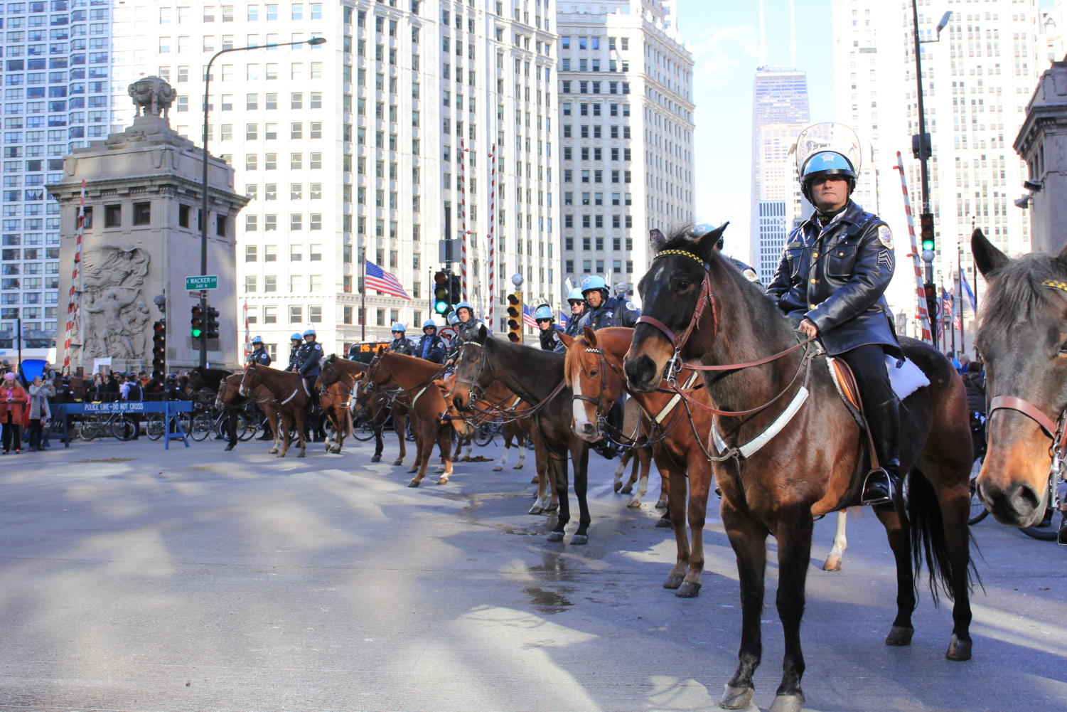 Police line up on horses to block off the protest.