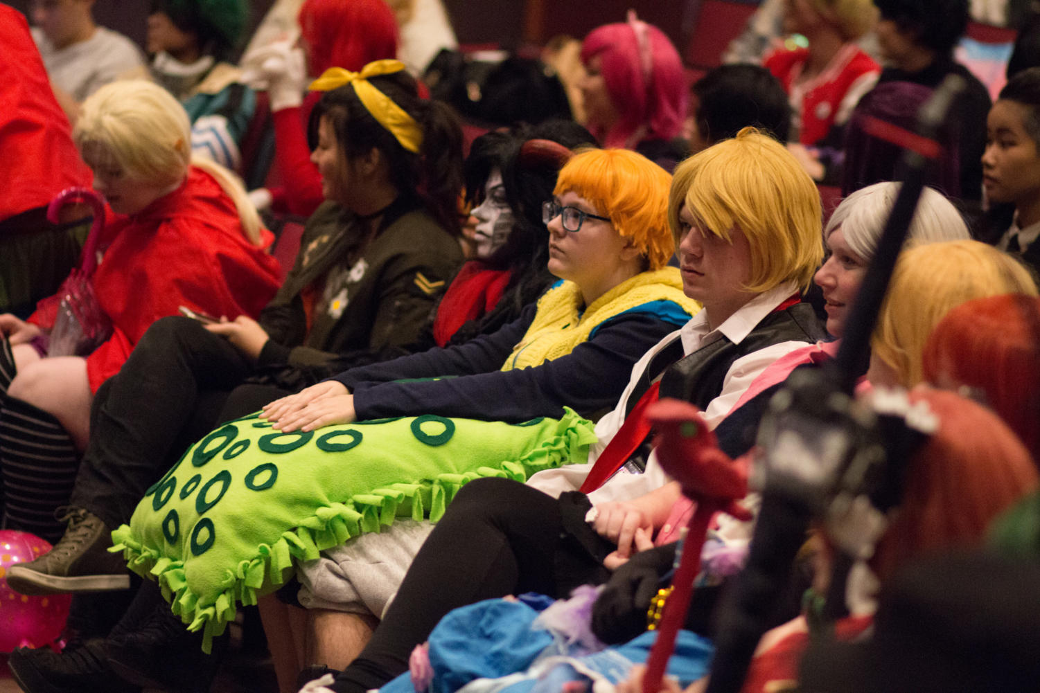 Cosplayers wait for the contest results to be announced.