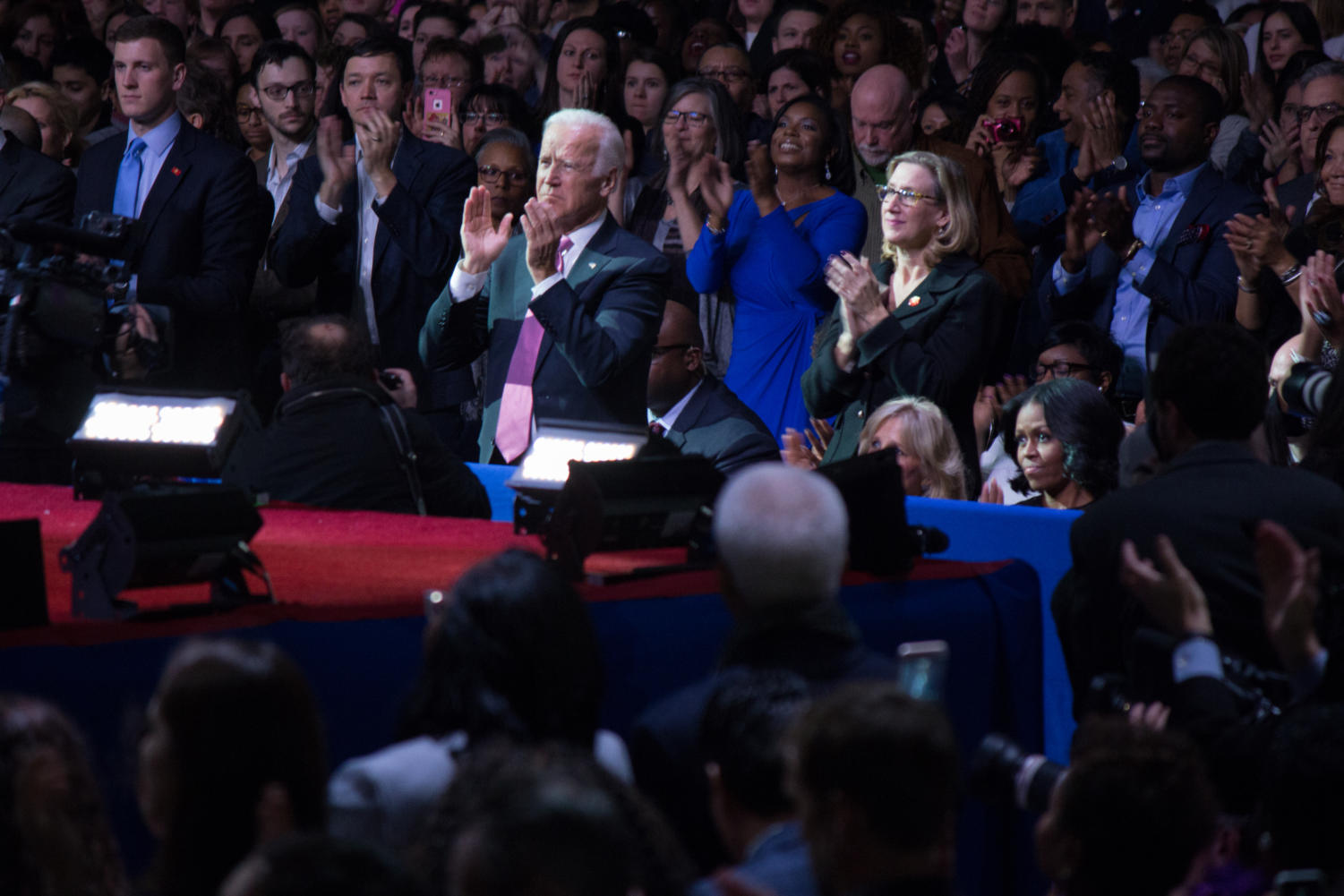 Vice President Joe Biden rises with the crowd to applaud Obama.