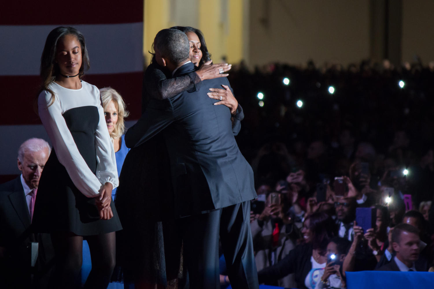 First Lady Michelle Obama hugs her husband.