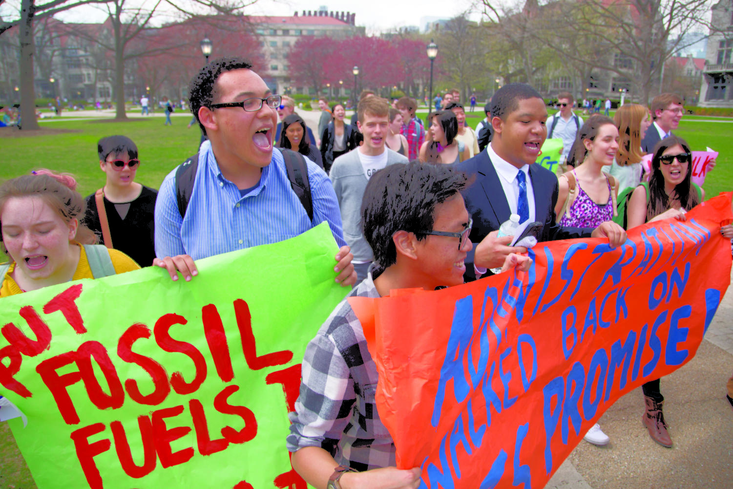 Students march backwards toward Levi Hall during the 