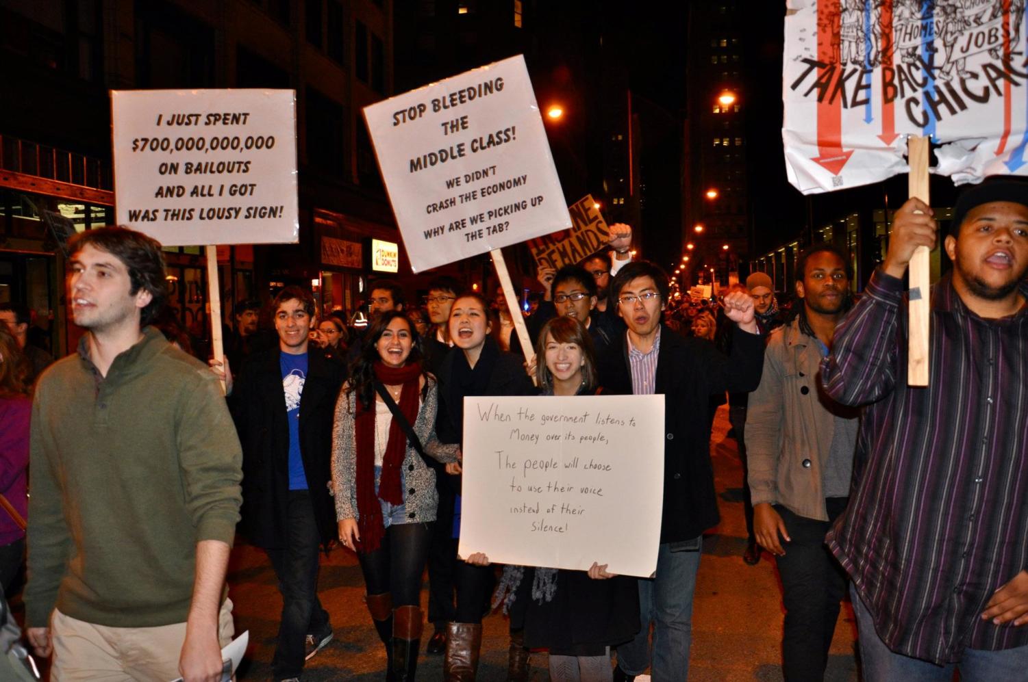 A group of University of Chicago students join in the Occupy Chicago demonstrations and march down Jackson Street toward Grant Park Saturday evening.