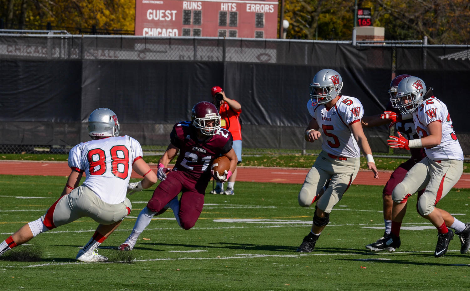 Third-year cornerback Vincent Beltrano returns the ball against Wash U at the Homecoming game last Saturday.