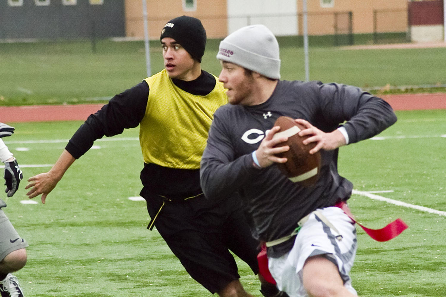 Intramural teams NWA and Violence Solves Everything compete during the men's undergraduate independent flag football final game on Sunday.