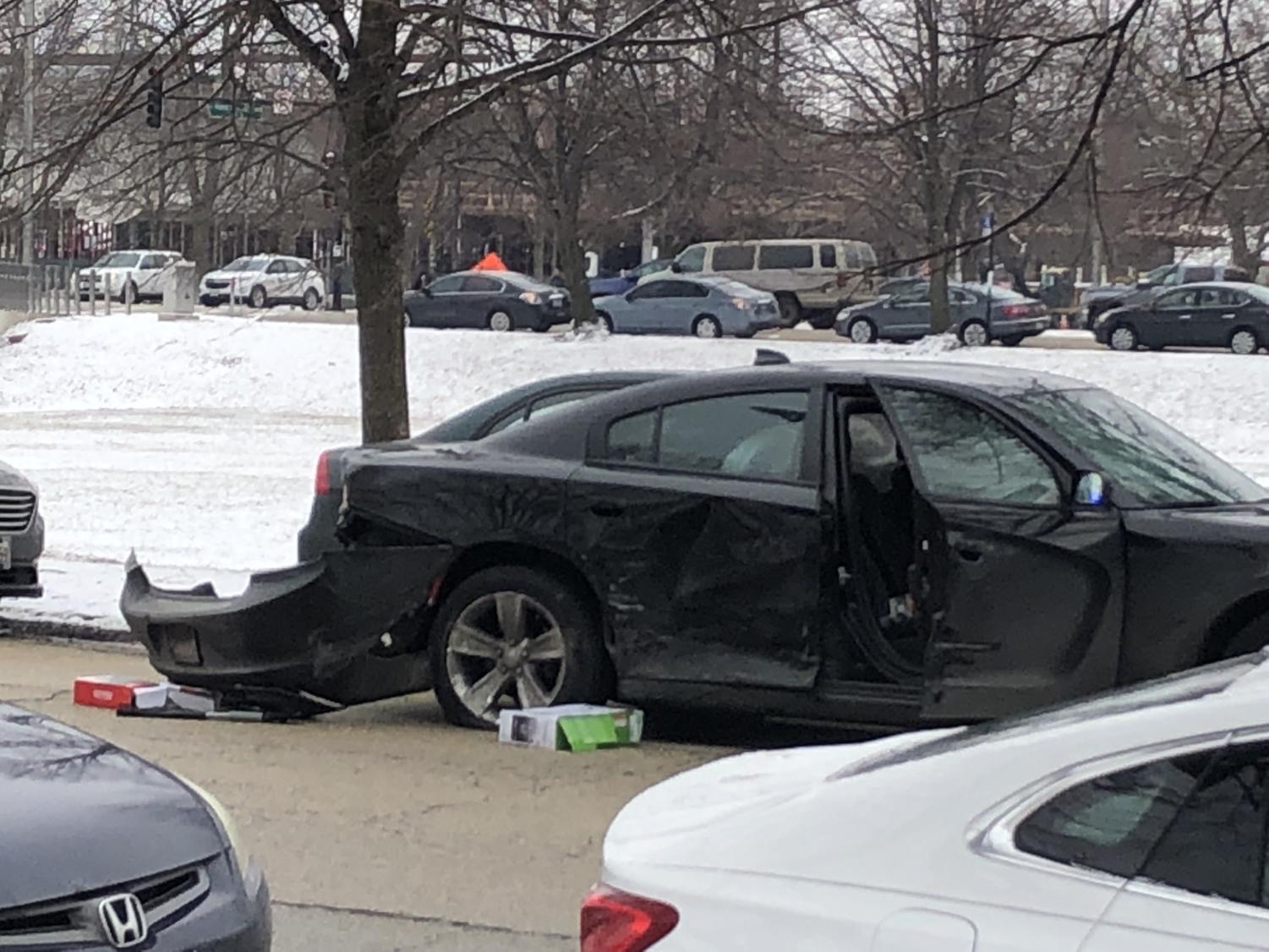 At 1:30 p.m., video game boxes were seen on the ground by the black Dodge Charger on Midway Plaisance near the intersection of South Woodlawn Avenue.