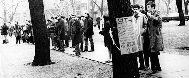 Signs around campus announced the 1969 sit-in protesting the firing of a faculty member.