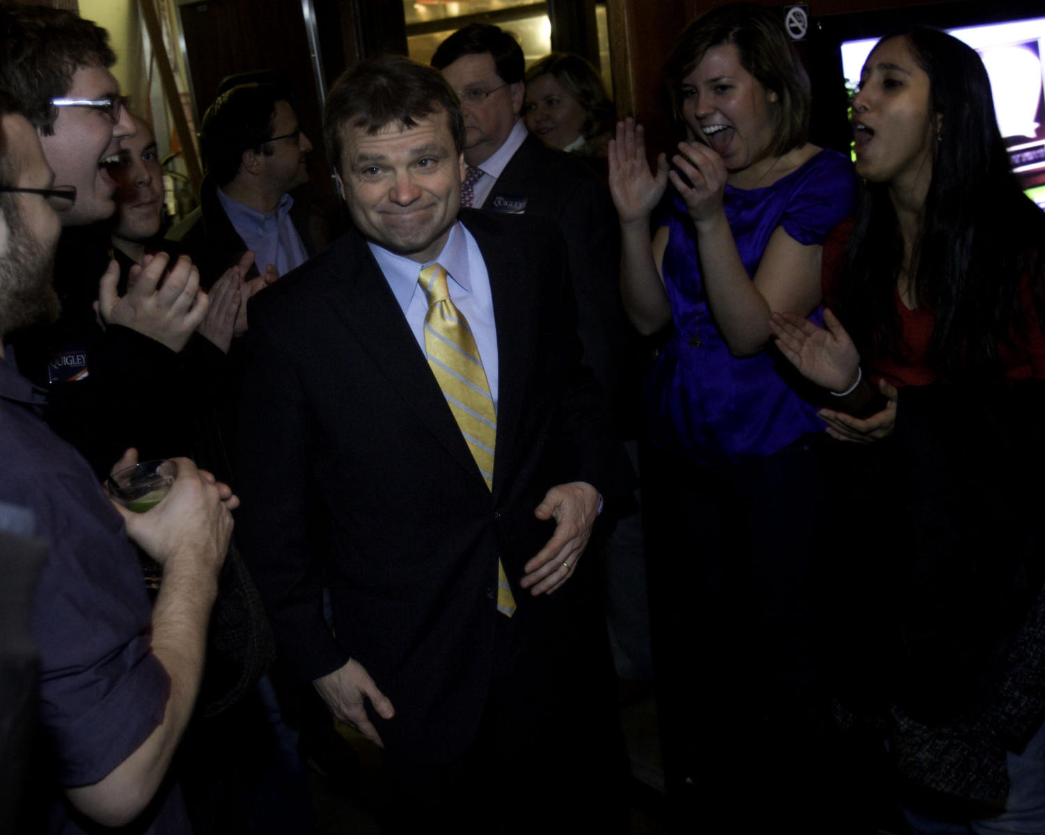 Mike Quigley enters the Wrigleyville brewery Red Ivy to deliver his victory speech.